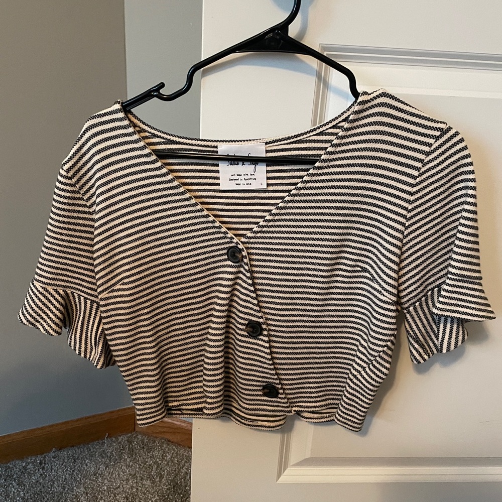 This cute tee is from Dry Goods! The brand is Sadie x Saige.